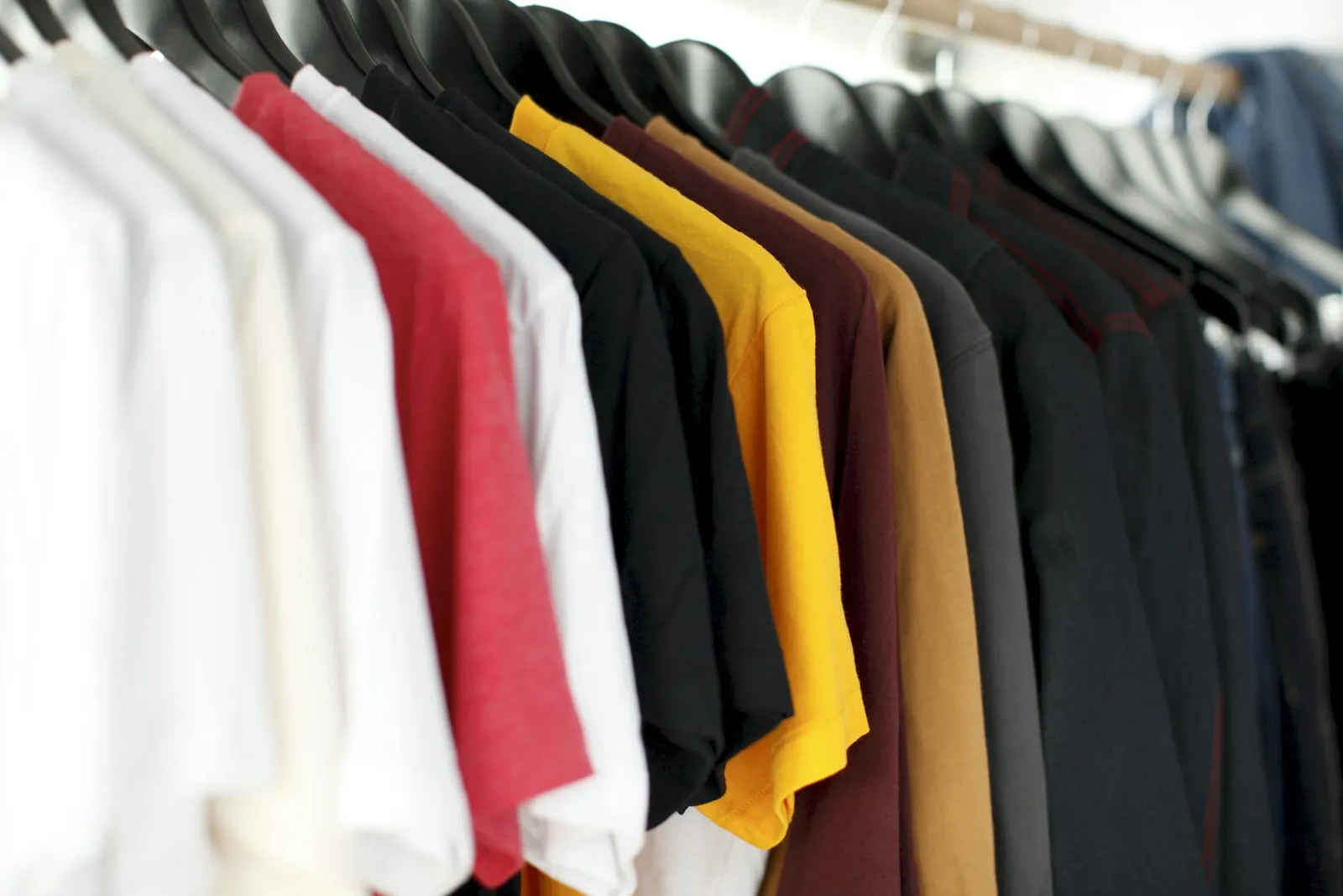 Rail of shirts in assorted colours