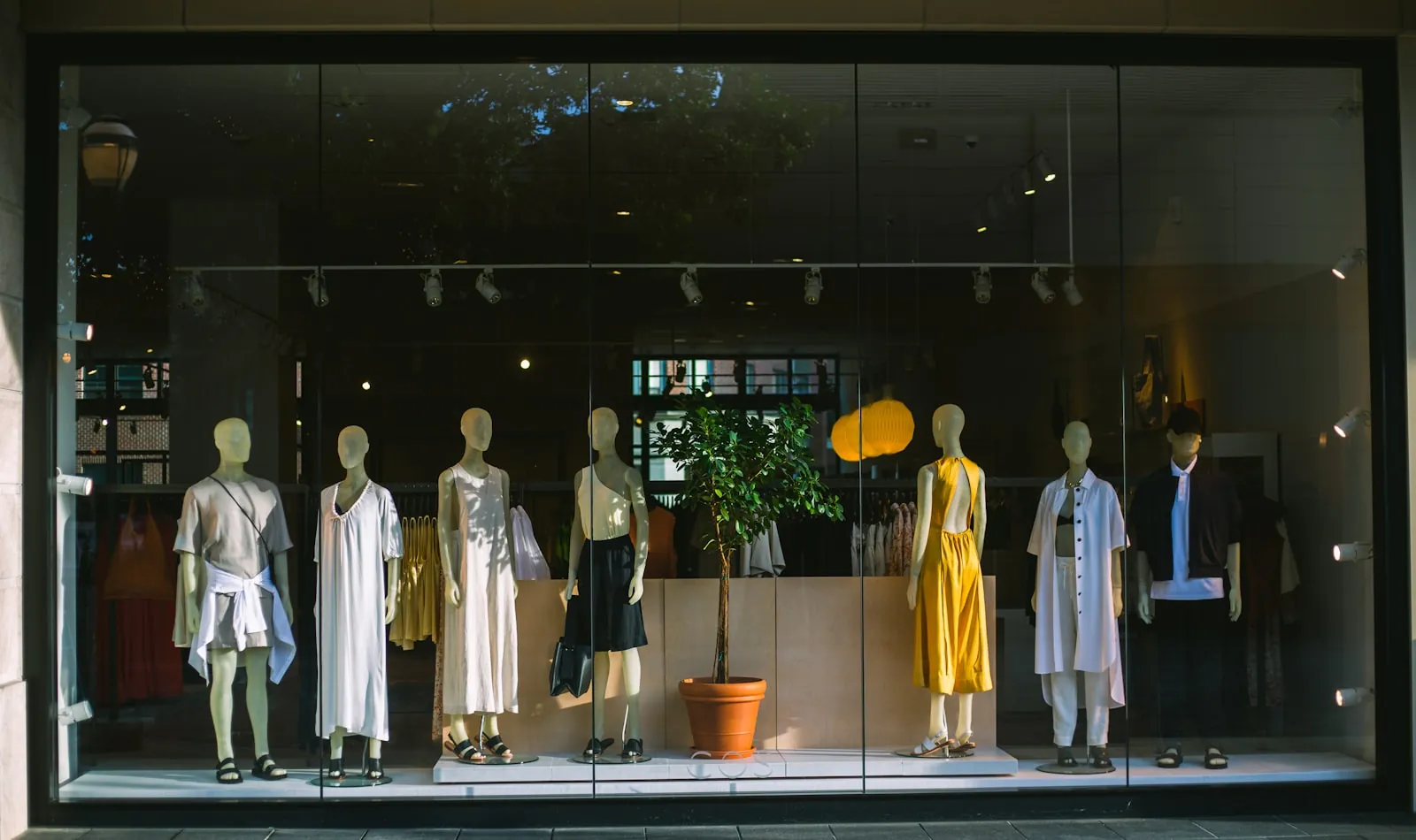 Shop window with resort wear on mannequins